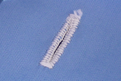 hand-stitched buttonhole on a shirt